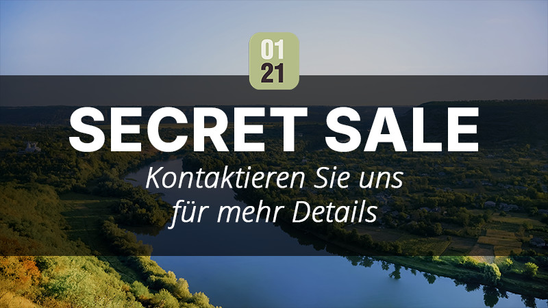 Una pittoresca vista aerea di un fiume e di verdi colline con il testo "01 21 VENDITA SEGRETA Contattaci per maggiori dettagli" – ideale se vuoi investire in una proprietà per le vacanze – sovrapposto in grassetto e bianco. 0121Management – ​​l'agente immobiliare per campeggi e proprietà per le vacanze. 